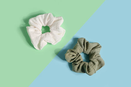 Two stylish scrunchies on color backgroundの写真素材