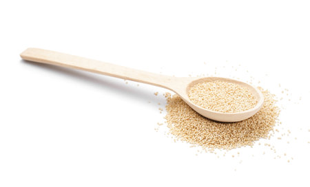 Wooden spoon of amaranth seeds on white backgroundの写真素材
