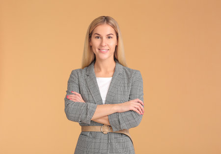 Stylish young woman on color backgroundの写真素材