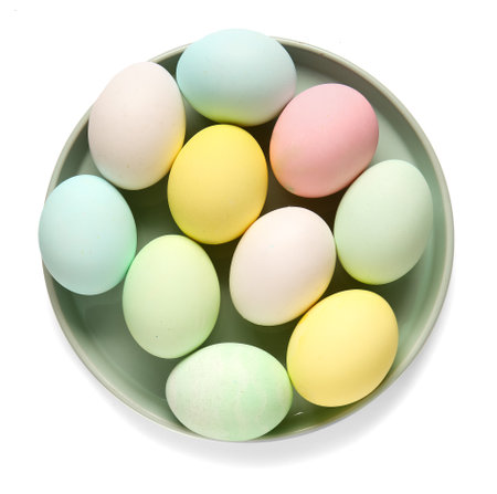 Plate with beautiful Easter eggs isolated on white background