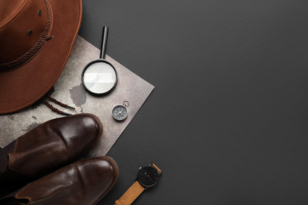 Compass with travel accessories on black backgroundの写真素材