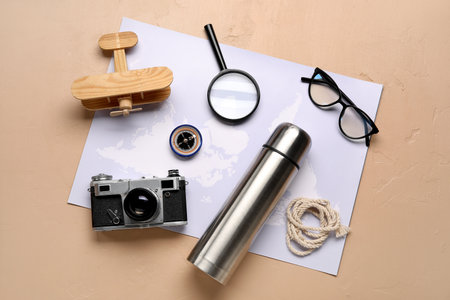 Compass with travel accessories on beige backgroundの写真素材