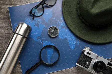 Compass with traveler accessories on dark wooden backgroundの写真素材