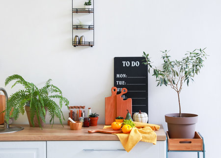 Counter with products and utensils in interior of modern kitchenの写真素材