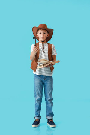 Surprised little adventurer on color backgroundの写真素材