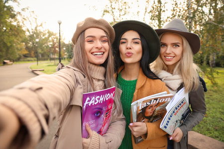 Beautiful young women taking selfie outdoorsの写真素材