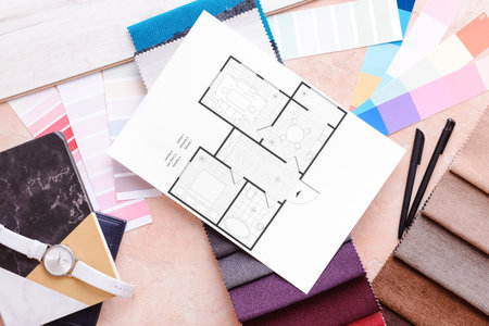 House plan, color palettes and fabric samples on color background