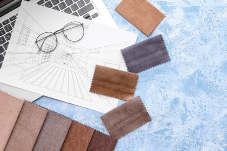 House plan, laptop and fabric samples on color backgroundの写真素材