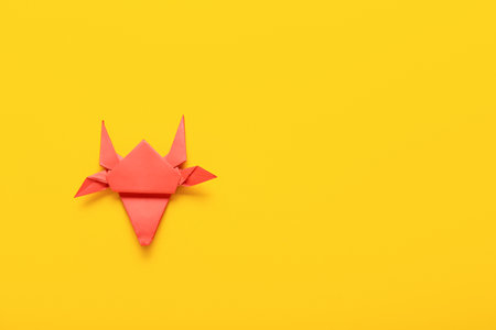 Origami bull as symbol of year 2021 on color backgroundの写真素材