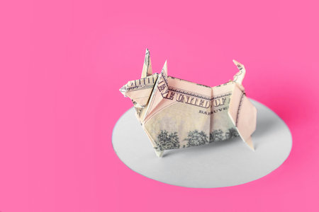 Origami bull as symbol of year 2021 on color background