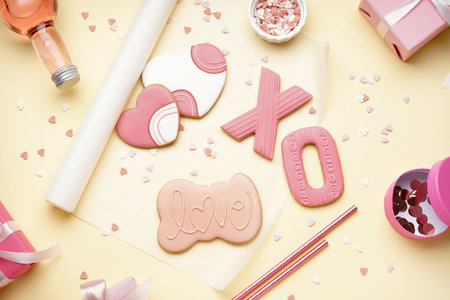 Composition with sweet cookies, sprinkles, confetti and bottle of drink on color background. Valentine's Day celebrationの写真素材