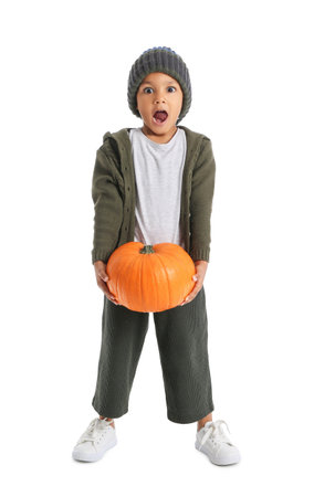 Surprised African-American boy with pumpkin on white backgroundの写真素材