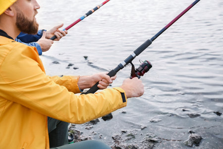 Young men fishing on the river