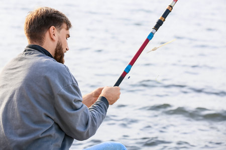 Young man fishing on the river