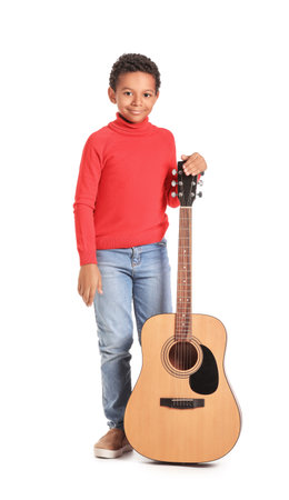 Little African-American boy with guitar on white backgroundの写真素材