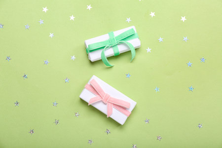 Sequins and gifts for Women's Day celebration on green background