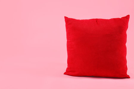 Red pillow on pink backgroundの写真素材