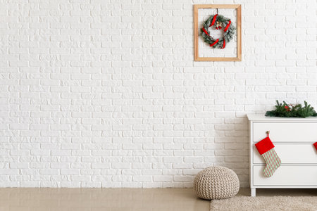 Beautiful Christmas wreath in the interior of the roomの写真素材