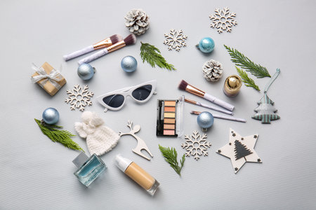 Christmas composition with cosmetics on light backgroundの写真素材