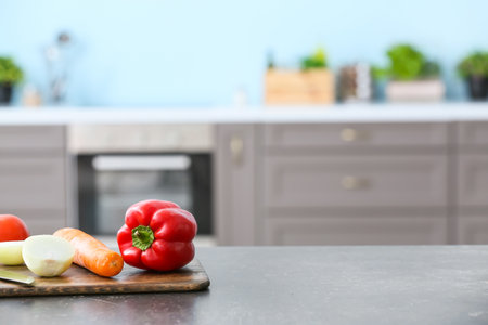 fresh vegetables on table in modern kitchenの写真素材
