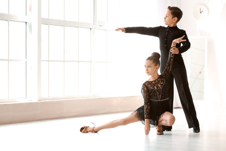 Cute little children dancing in studio