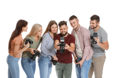 Group of young photographers on white backgroundの写真素材
