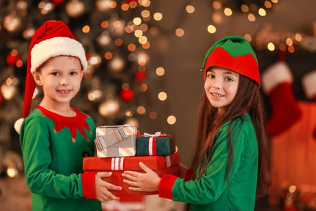 Cute little elves with Christmas gifts at home