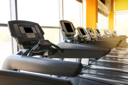 Interior of modern gym with treadmillsの写真素材