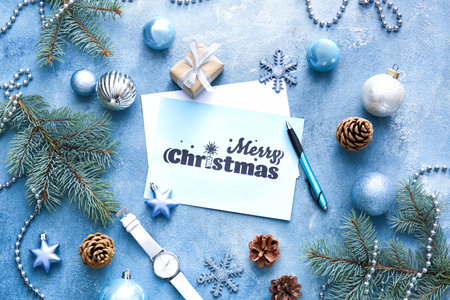 Beautiful greeting card for Christmas celebration and decor on color backgroundの写真素材