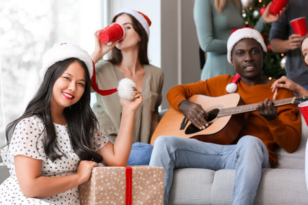 Young people celebrating New Year at home partyの写真素材