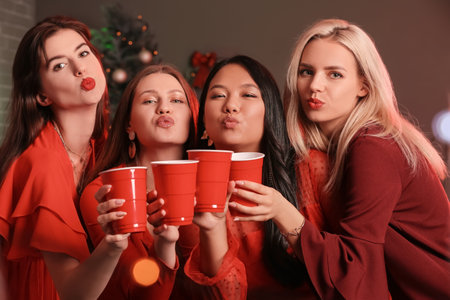 Young women celebrating New Year in night clubの写真素材