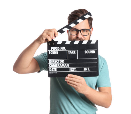 Bearded man with movie clapper on white backgroundの写真素材