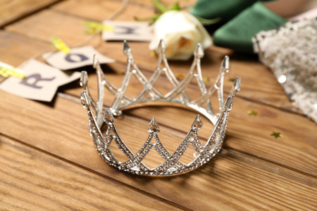 Beautiful tiara on wooden table, closeup. Prom conceptの写真素材