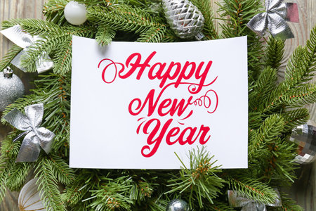 Beautiful composition with New Year greeting card on wooden backgroundの写真素材