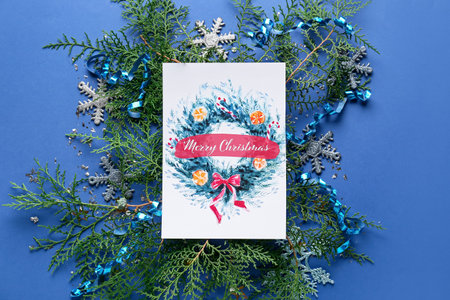 Beautiful composition with Christmas greeting card on color backgroundの写真素材