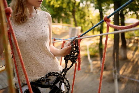 Teenage girl climbing in adventure parkの写真素材