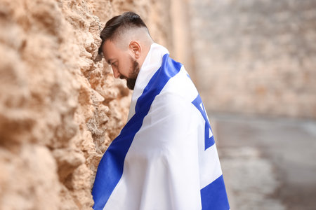 Man with the flag of Israel near the Wailing Wallの写真素材