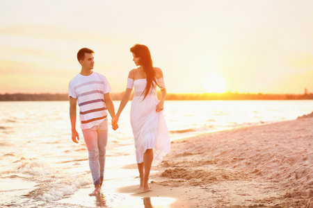 happy young couple on sea beachの写真素材
