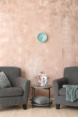 Armchairs and tables in the interior of the living room