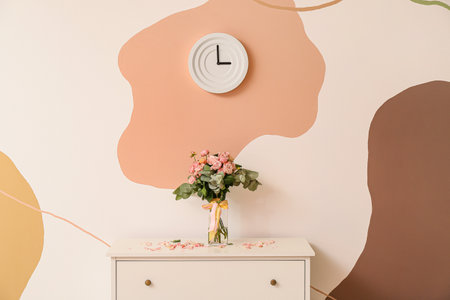 Interior of room with chest of drawers and clock