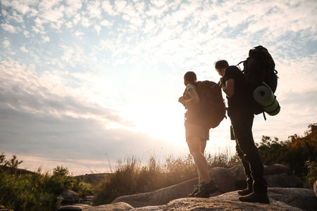 Couple of young tourists in countrysideの写真素材