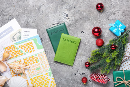 Composition with Christmas decor, map, and passports on grunge backgroundの写真素材