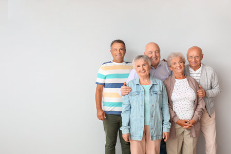senior people near light wall in roomの写真素材