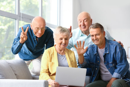 Group of senior people video chatting at homeの写真素材