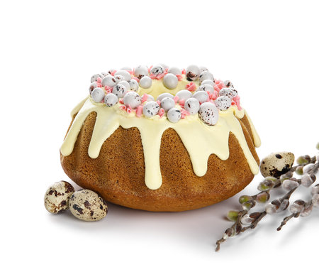 Sweet Easter cake with eggs and willow branches on white background