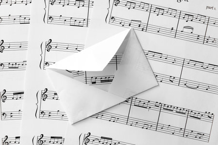 Music sheets with envelope, closeup