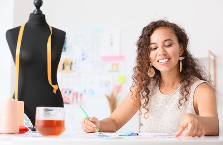 Female fashion designer working in studio