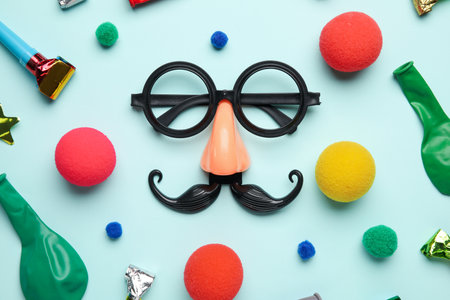 Party decor for April Fools' Day celebration on blue backgroundの写真素材