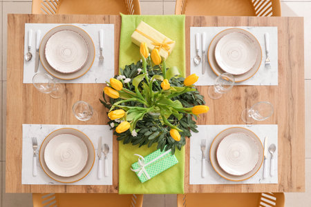Setting for International Women's Day celebration with flowers and gifts on tableの写真素材