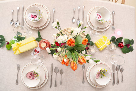 Setting for International Women's Day celebration with flowers and gift boxes on table